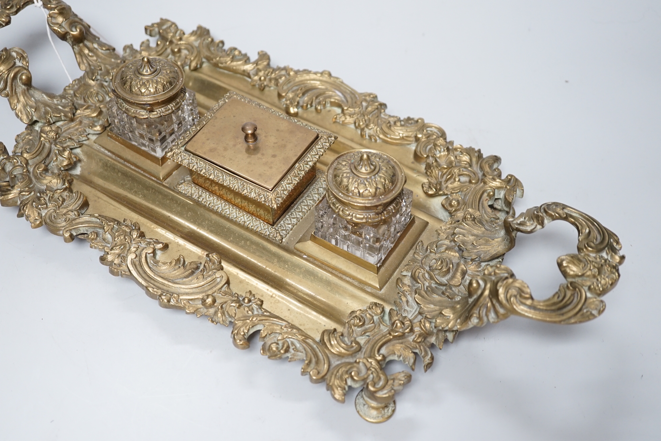 An early 20th century French cast brass desk stand, 45cm long